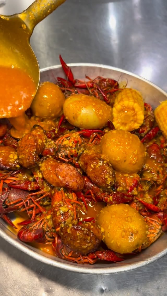 Crawfish being sauced in the kitchen