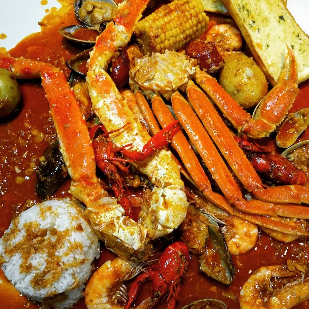 Full seafood spread — crab, crawfish, clams